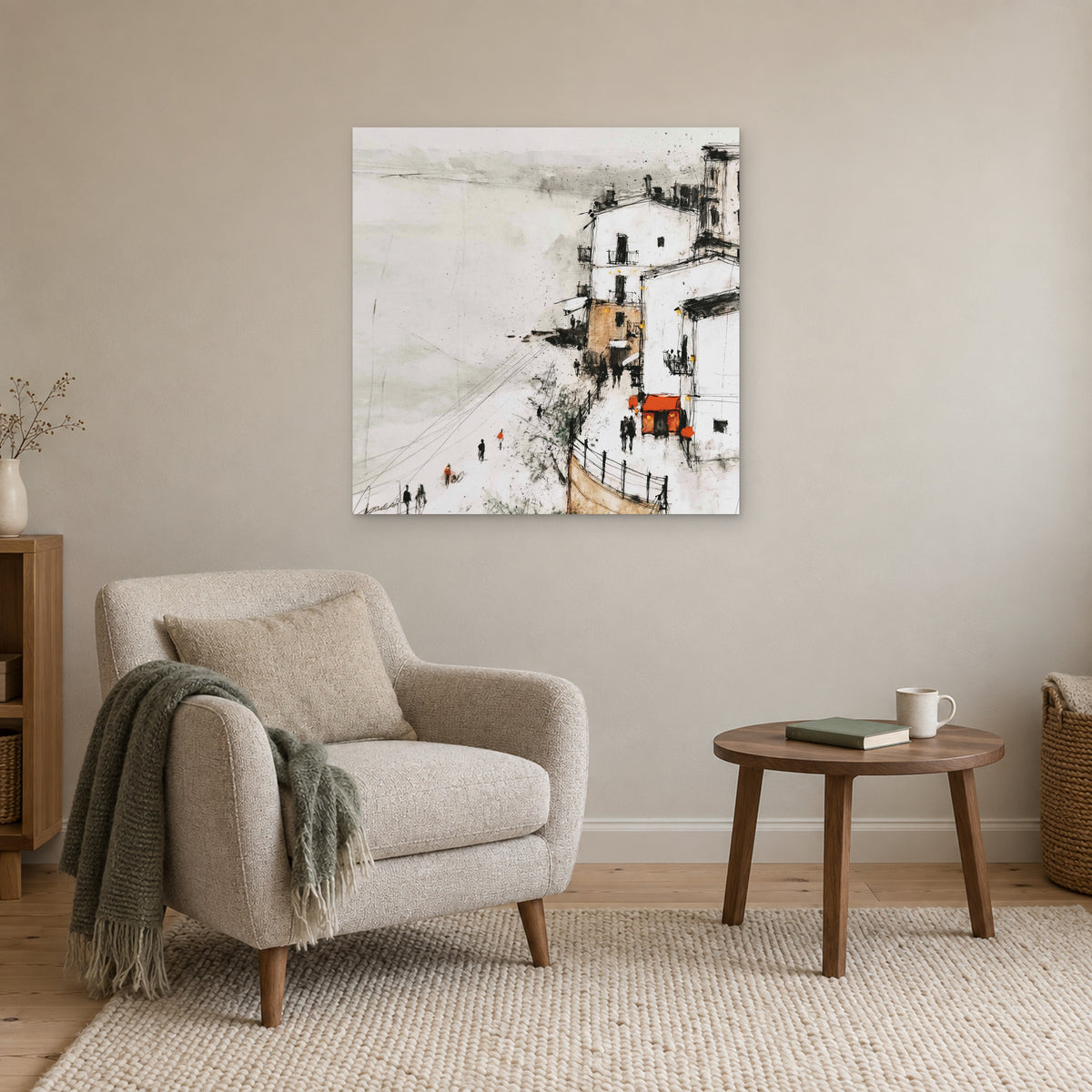 Sicilian Cliff Town Above the Sand canvas wall art above a cream armchair and round wooden side table