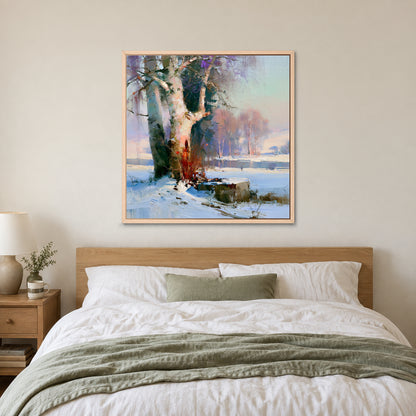Birches on the Frozen River framed canvas in a natural wood floating frame above a bed with white linens and a sage throw