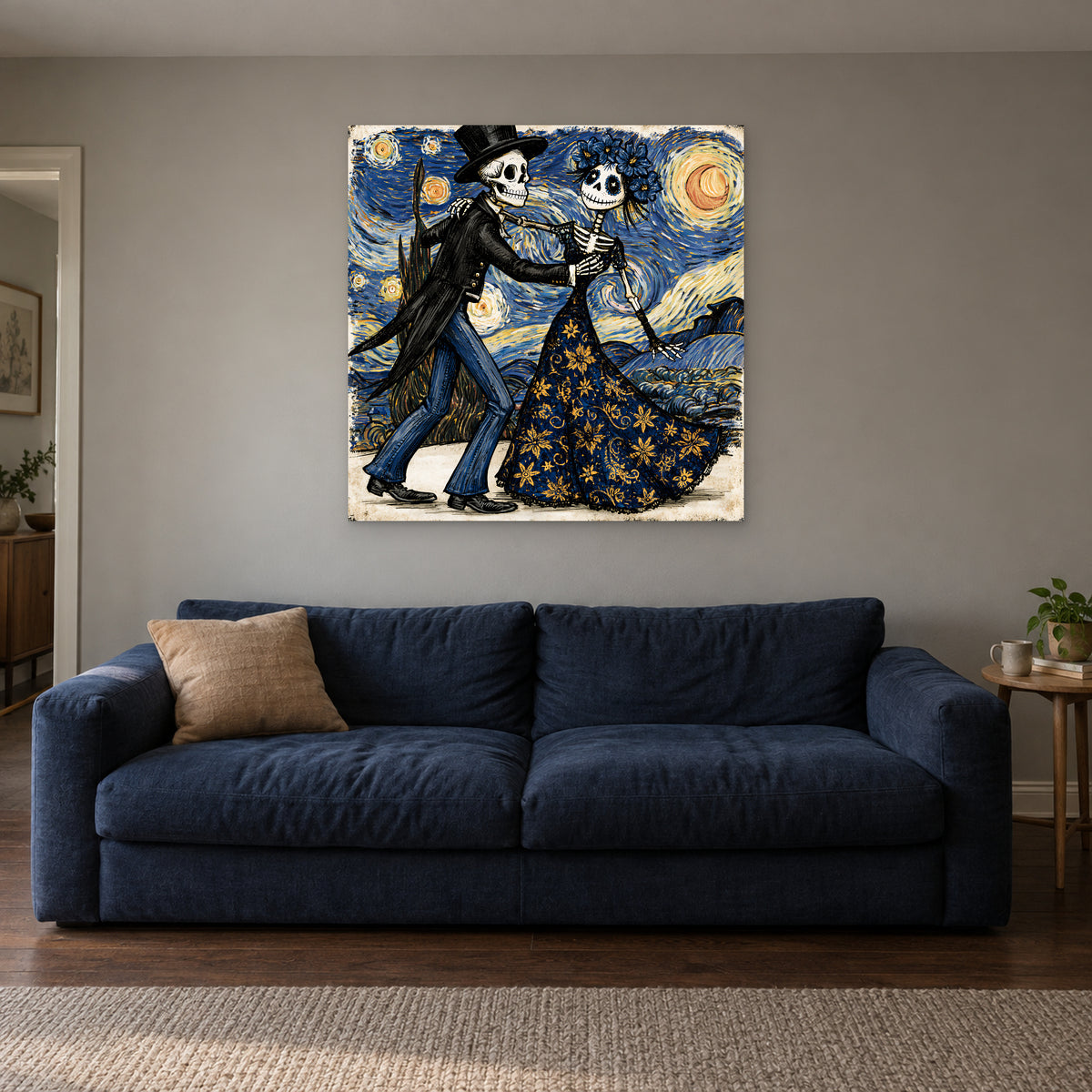 Skeletons Dancing Under Stars canvas wall art above a navy sofa in a living room