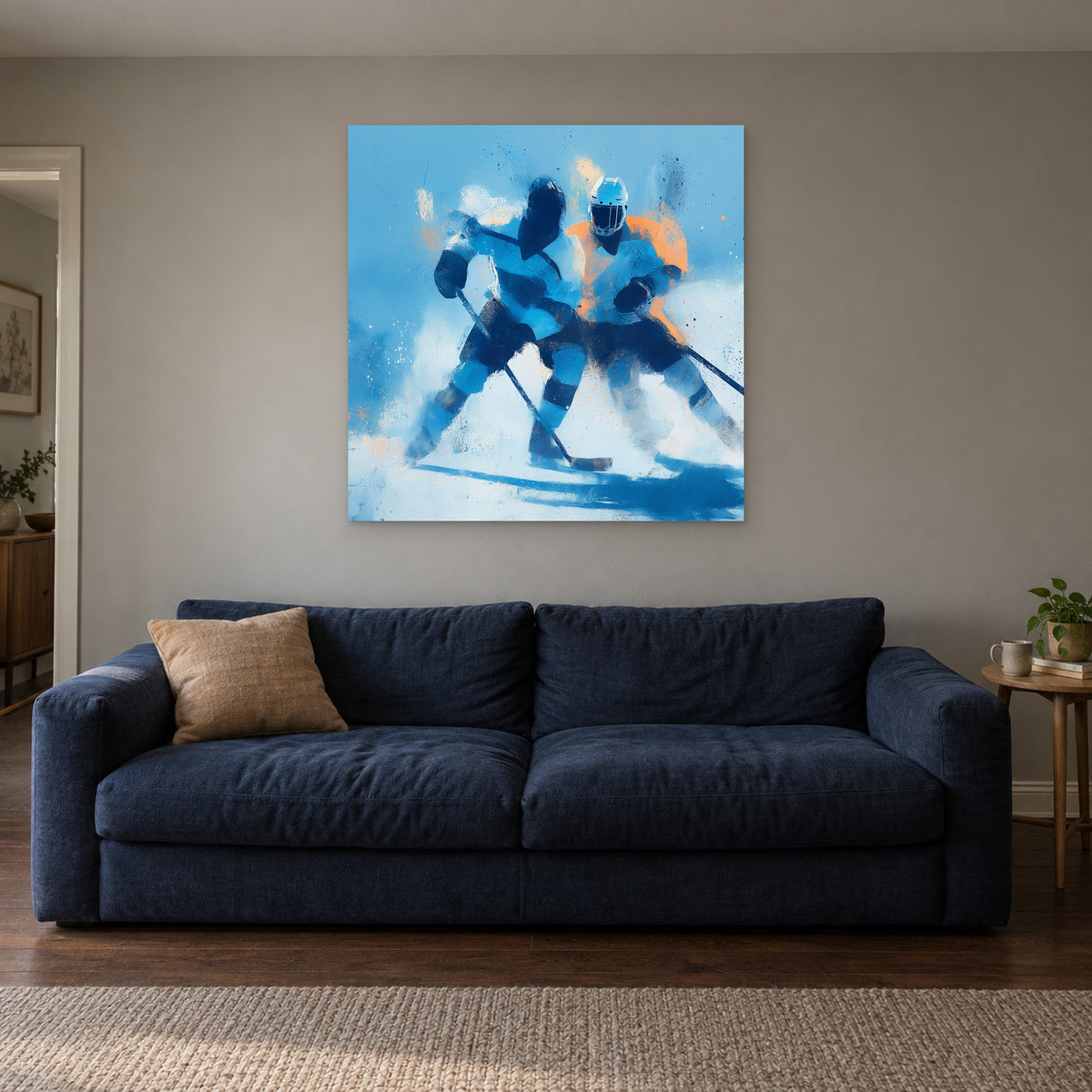 Hockey Chasing the Puck canvas wall art above a navy sofa in a living room