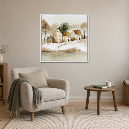 Farmhouses Above the Frozen Pond framed canvas in a white floating frame above a cream armchair and round wooden side table