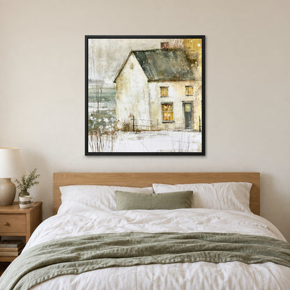 A Single Lit Farmhouse framed canvas in a black floating frame above a bed with white linens and a sage throw