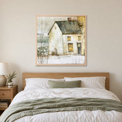 A Single Lit Farmhouse framed canvas in a natural wood floating frame above a bed with white linens and a sage throw