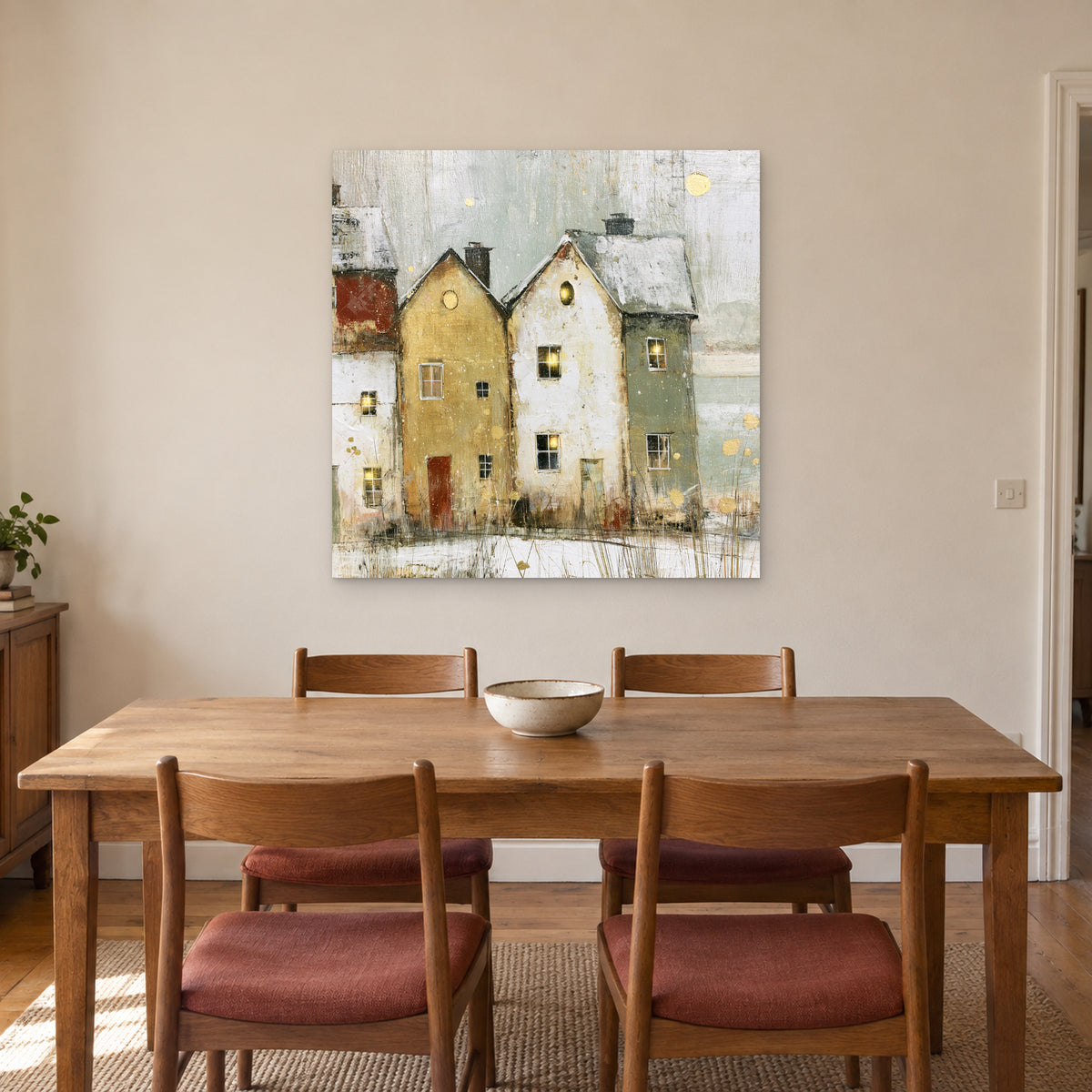 Two Gables Round Attic Windows canvas wall art above a wooden dining table with rust-cushioned chairs