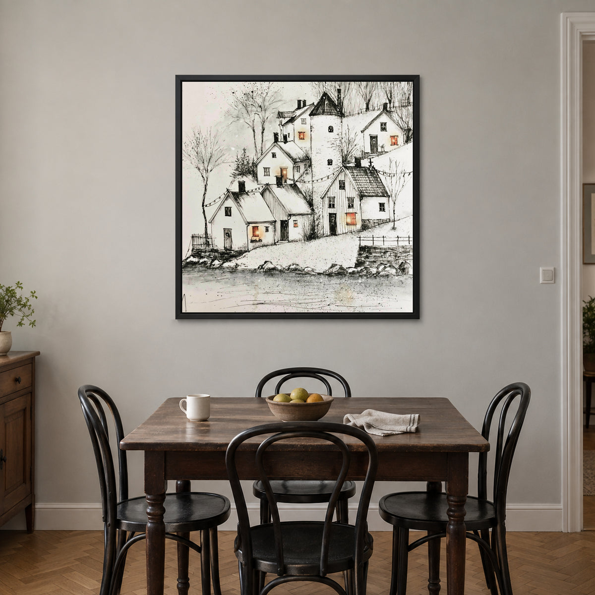 String Lights Over the Rooftops framed canvas in a black floating frame above a small wooden dining table with black bentwood chairs