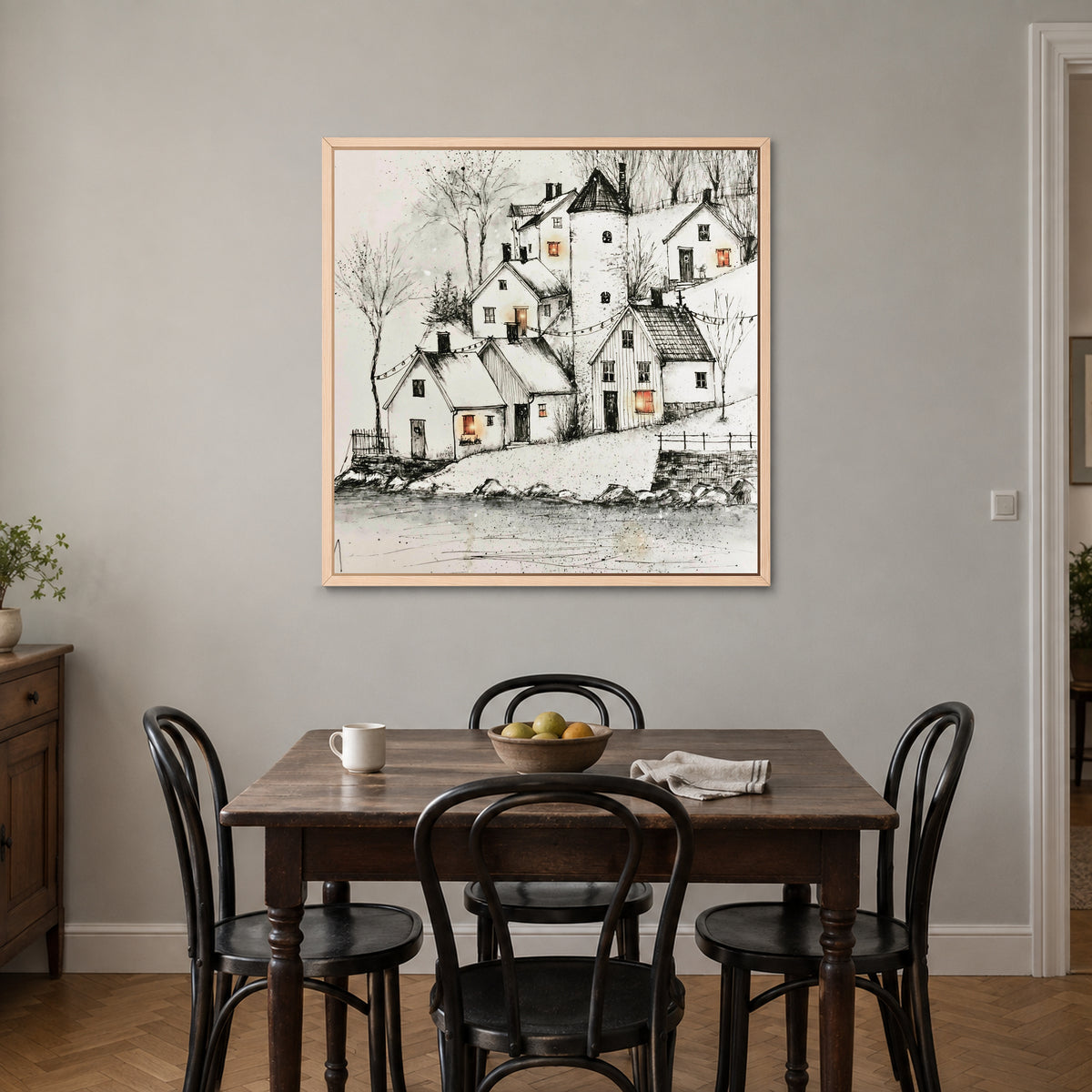 String Lights Over the Rooftops framed canvas in a natural wood floating frame above a small wooden dining table with black bentwood chairs