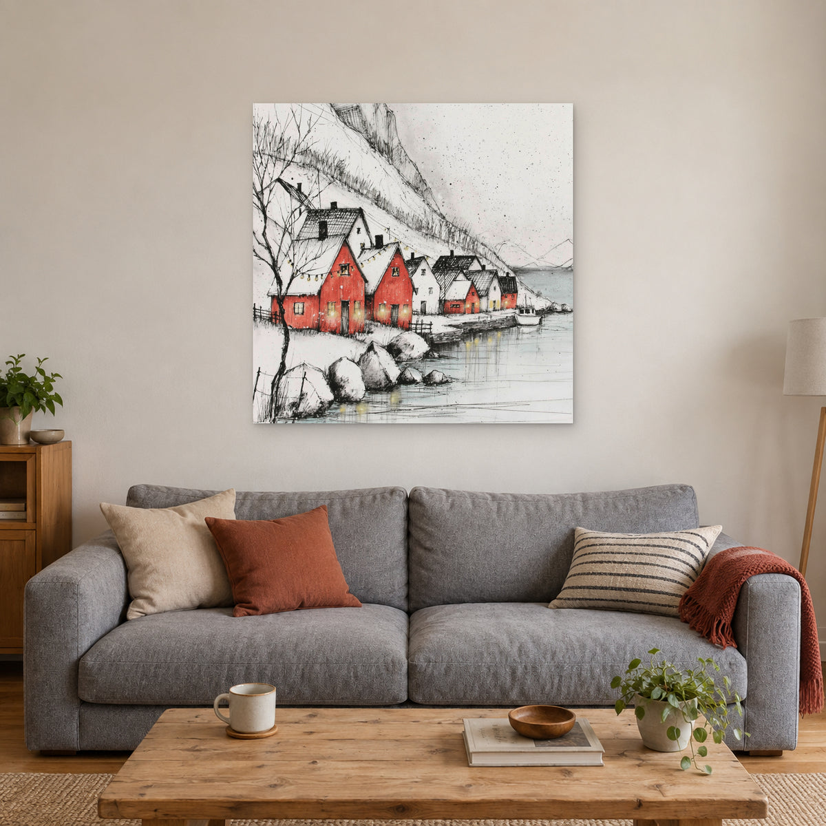 Scandinavian Red Boathouses Winter canvas wall art above a grey sofa with rust and striped cushions