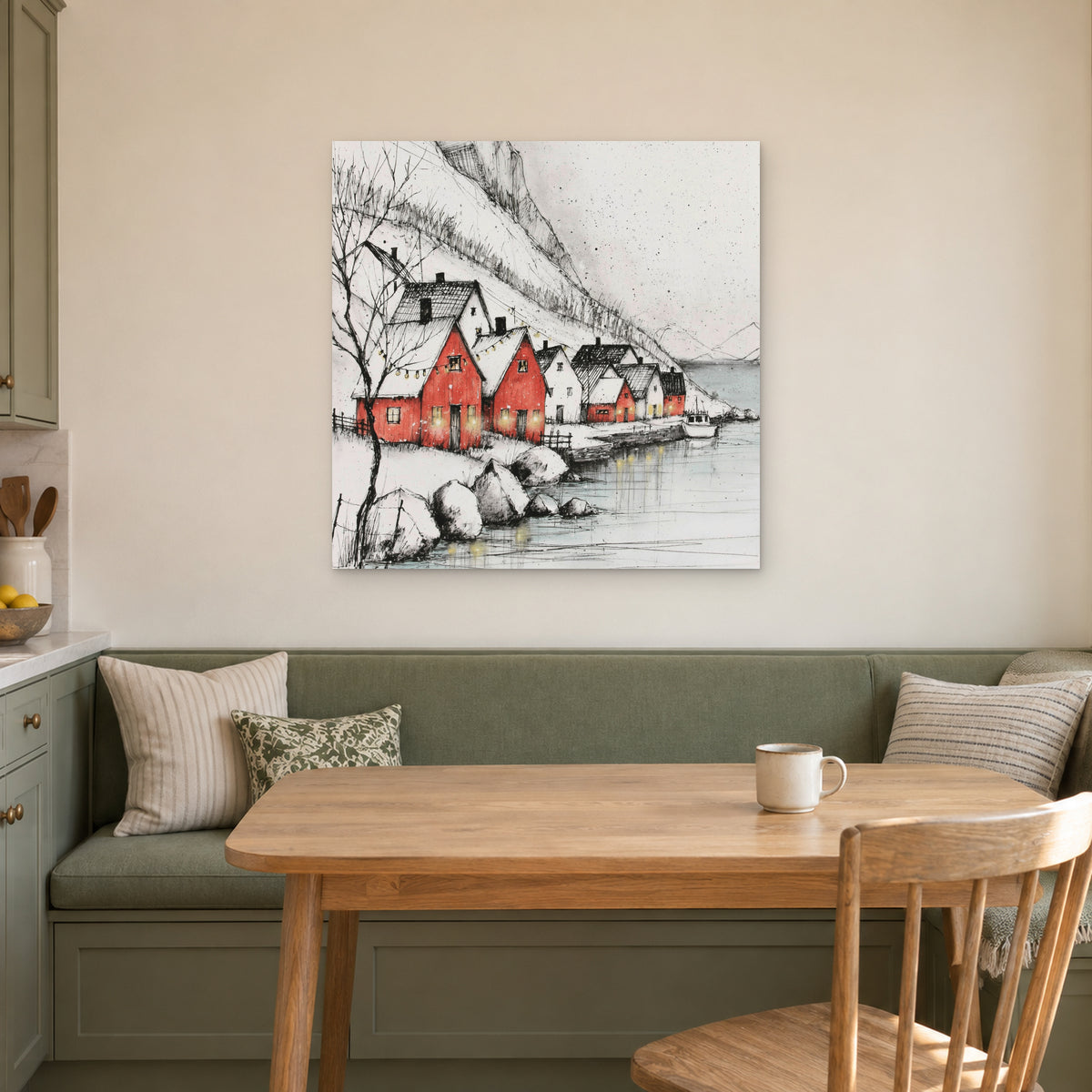 Scandinavian Red Boathouses Winter canvas wall art above a green banquette and wooden table in a breakfast nook