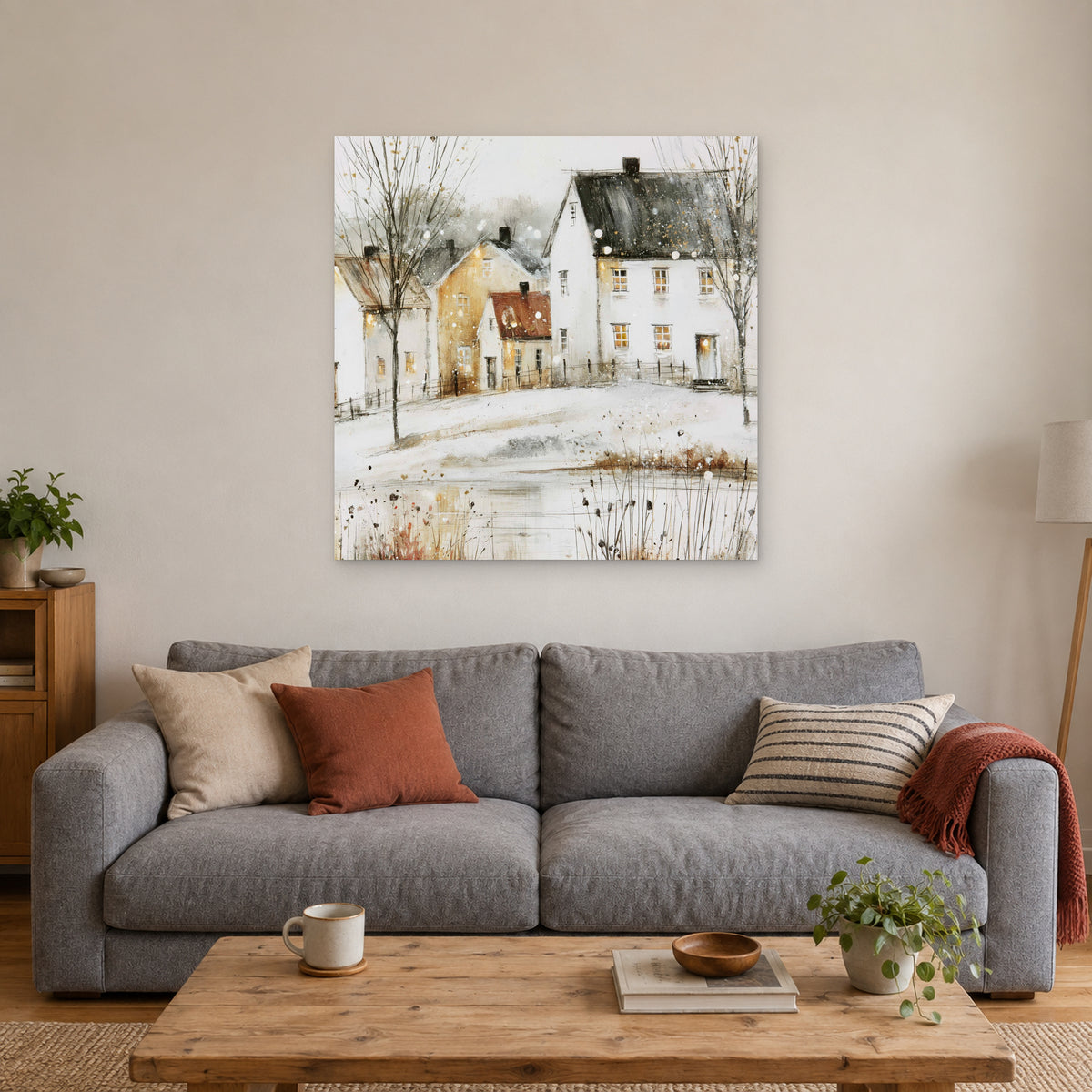 Amber Windows in Scandinavian Snow canvas wall art above a grey sofa with rust and striped cushions