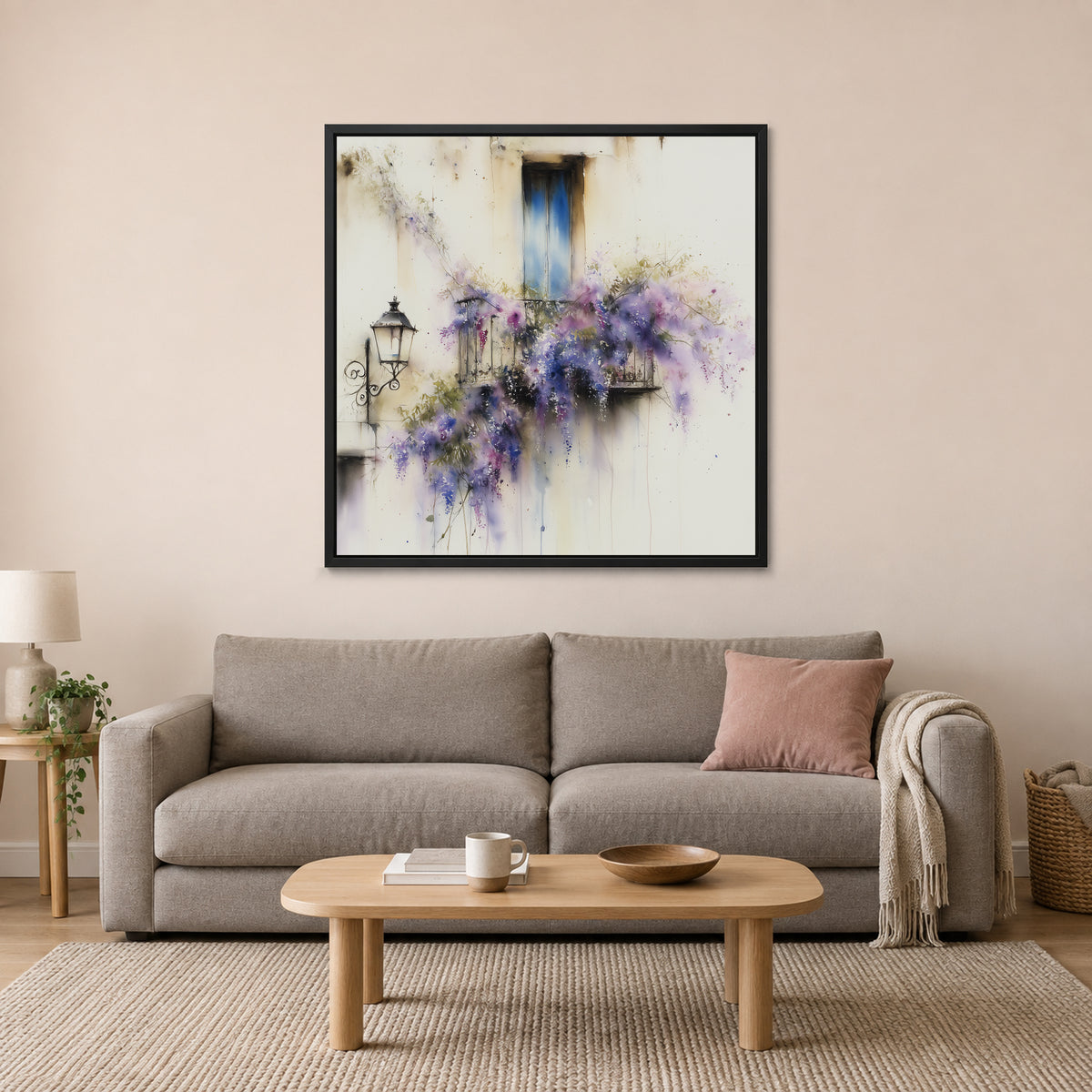 Wisteria in Full Bloom framed canvas in a black floating frame above a taupe sofa with a pink cushion and an oval wooden coffee table